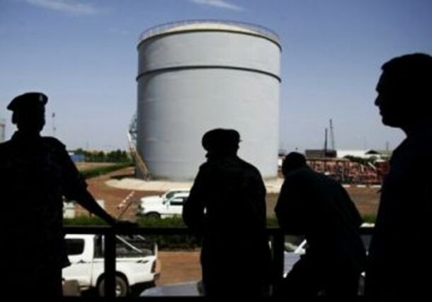 South Sudanese security forces wait outside the control room of the Petrodar oil facility in Paloich AFP file photo