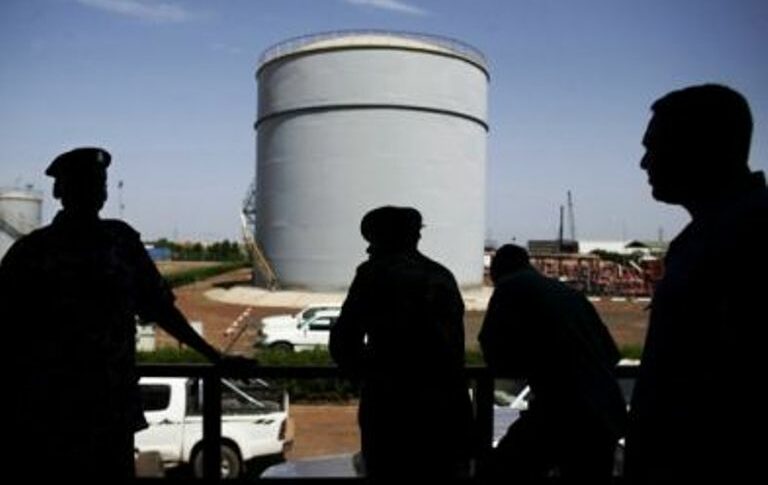 South Sudanese security forces wait outside the control room of the Petrodar oil facility in Paloich AFP file photo