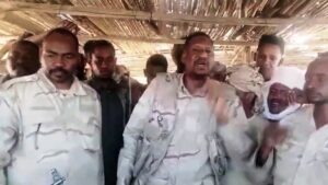 Abdel Rahim speaks surrounded with RSF fighters in Khartoum on APril 22, 2023