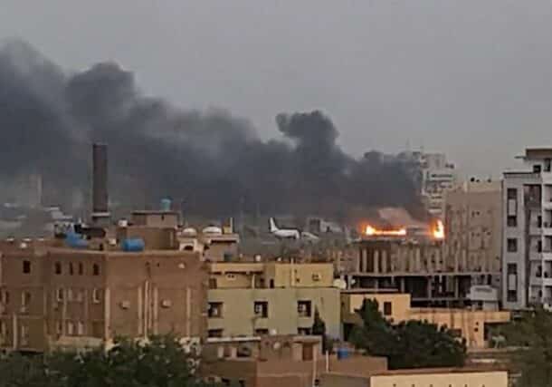 Smoke rises from the tarmac of Khartoum International Airport as a fire burns, in Khartoum, Sudan April 17, 2023 in this screen grab obtained from a social media video. Abdullah Abdel Moneim/via REUTERS