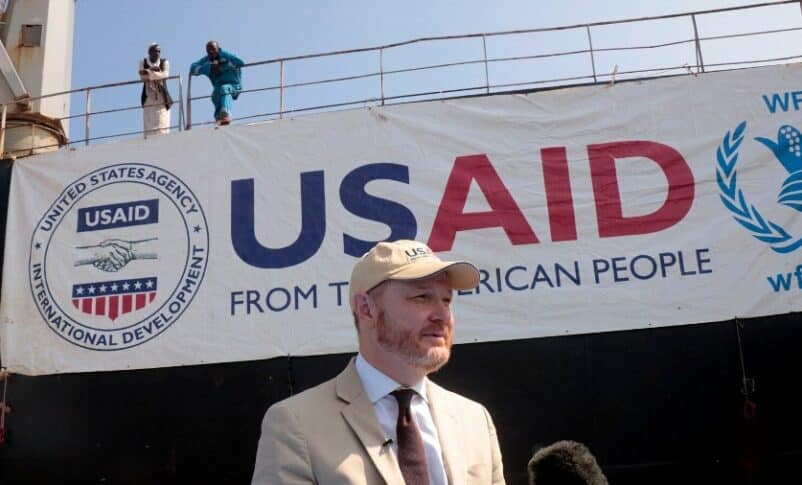 U.S. Ambassador to Sudan John Godfrey speaks during the delivery of tons of corn in Port Sudan as part of the U.S' support for Sudan on November 20, 2022