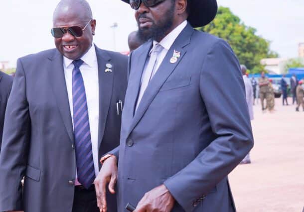 South Sudan's President Salva Kiir shares a light moment with First Vice President Riek Machar at Juba airport, June 27, 2023 (PPU photo)
