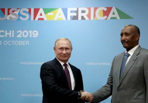 Al-Burhan shakes hands with President Putin on October 23, 2019