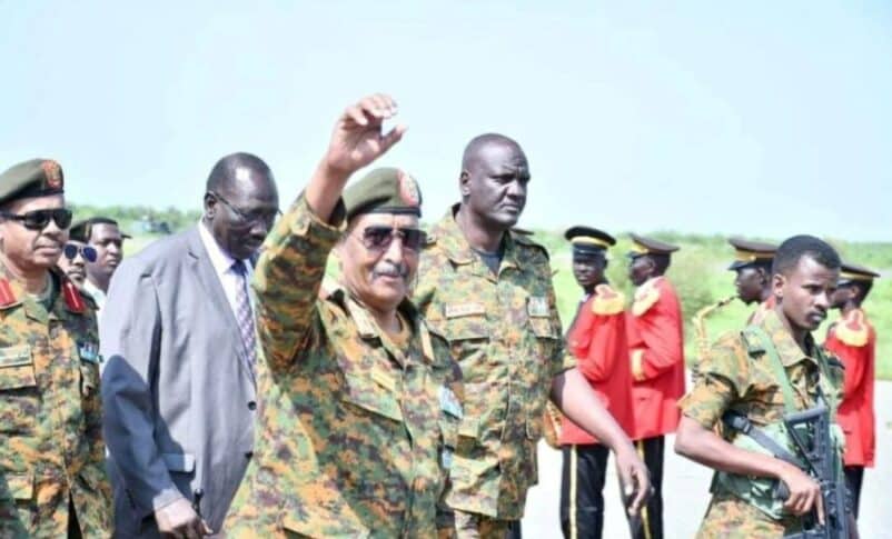 Al-Burhan waves hand after his arrival in Ed Damazin on September 9, 2023