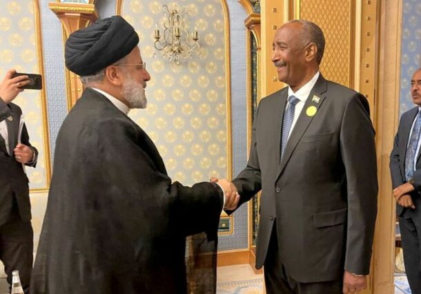 Al-Burahn shakes hands with Iranian President Raisi in Riyadh on November 11, 2023