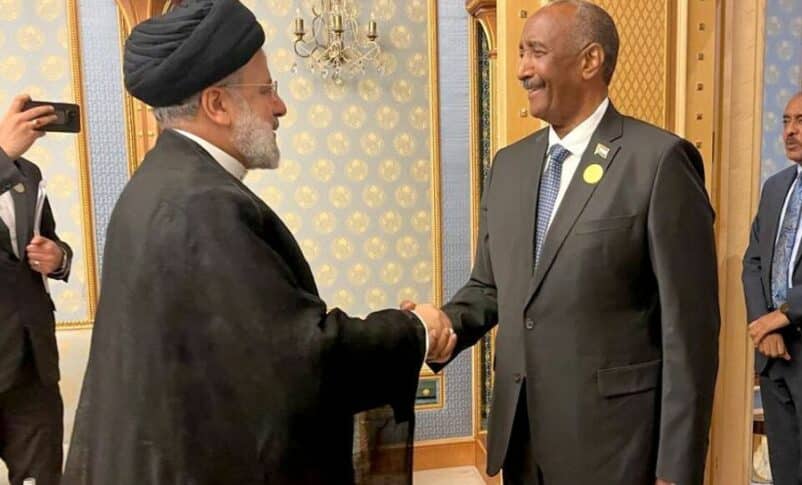 Al-Burahn shakes hands with Iranian President Raisi in Riyadh on November 11, 2023