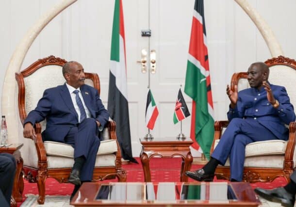 Al-Burhan listen to Ruto during a meeting in Nairobi on November 13, 2023