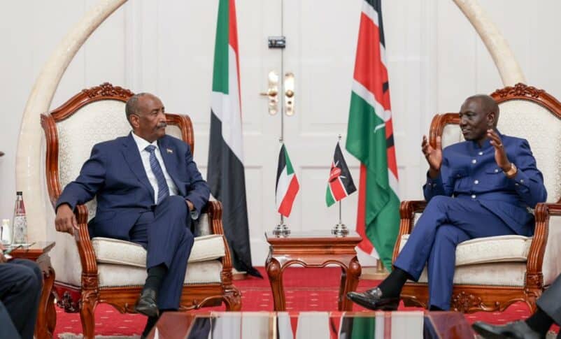 Al-Burhan listen to Ruto during a meeting in Nairobi on November 13, 2023
