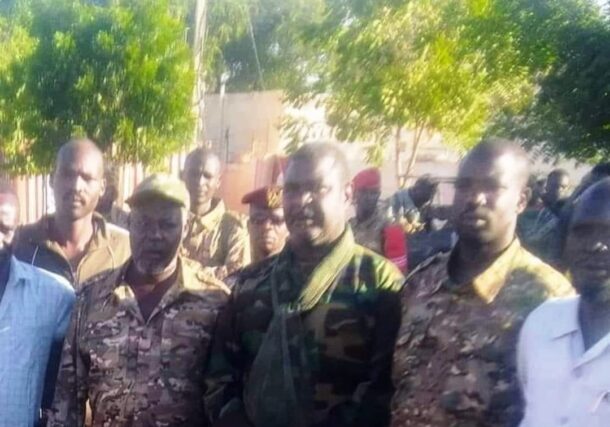 Youssef Karjola (L) SLM-AW military commander, and Al-Sadiq Al-Fakka (C) a Sudanese army officer poese in El Fasher on November 24, 2023