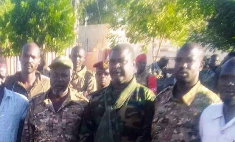 Youssef Karjola (L) SLM-AW military commander, and Al-Sadiq Al-Fakka (C) a Sudanese army officer poese in El Fasher on November 24, 2023