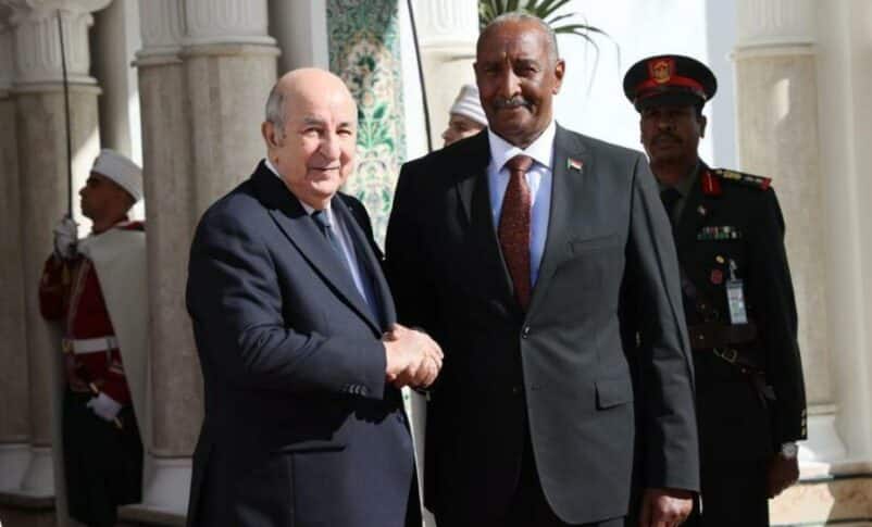 Algerian President Abdelmadjid Tebboune receives Sovereign Council Chairman Abdel Fattah al-Burah at the entrence of the presidential palace in Alger on January 28, 2024.