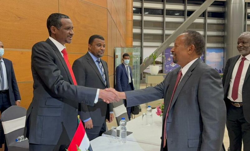 Former PM Abdallah Hamdok shakes and with RSF leader Mohamed Hamdan Daglo before a joint meeting in Addis Ababa on December 1, 2023