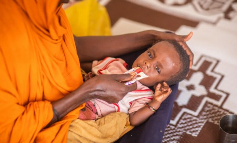A child receives a life-saving therapeutic food treatment (UNICEF photo)