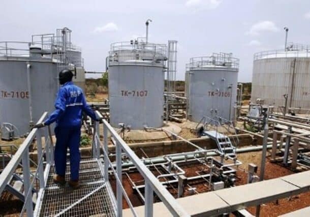 A worker walks at the power plant of an oil processing facility at an oilfield in Unity State April 22, 2012 Reuters