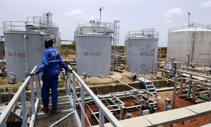 A worker walks at the power plant of an oil processing facility at an oilfield in Unity State April 22, 2012 Reuters