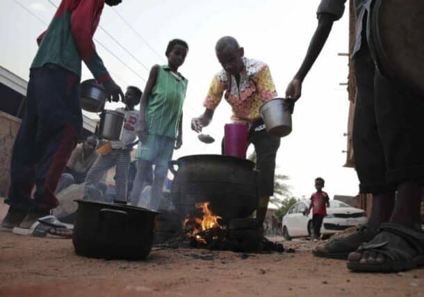 People prepare food in a Khartoum neighbourhood Friday, June 16, 2023. (AP photo