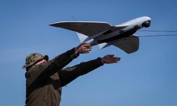 A Ukrainian soldier launches a Furiia model reconnaissance drone (Reuters photo)