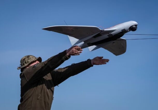 A Ukrainian soldier launches a Furiia model reconnaissance drone (Reuters photo)