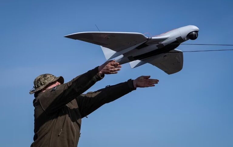 A Ukrainian soldier launches a Furiia model reconnaissance drone (Reuters photo)