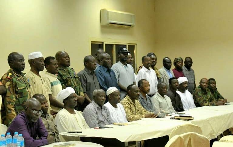 Leaders of Darfur groups pose ensemble after agreement to join efforts against the RSF in Barkal on April 28, 2024