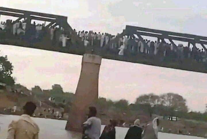 Civilians cross Al-Dinder Bridge heading to Gederaf after the REF control of the town on July 5, 2024
