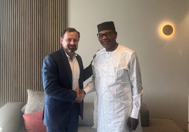 U.S.Envoy Tom Perriello shakes hands with Mohamed Ibn Chambas, Chair of the African Union Panel on Sudan in Geneva on August 13, 2024