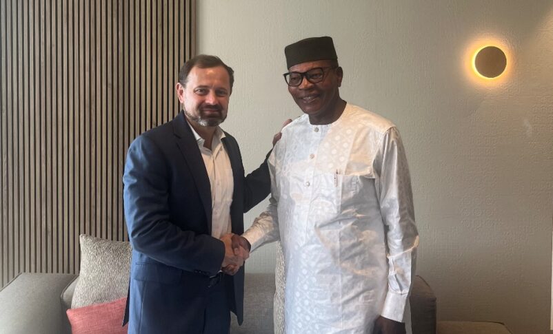 U.S.Envoy Tom Perriello shakes hands with Mohamed Ibn Chambas, Chair of the African Union Panel on Sudan in Geneva on August 13, 2024