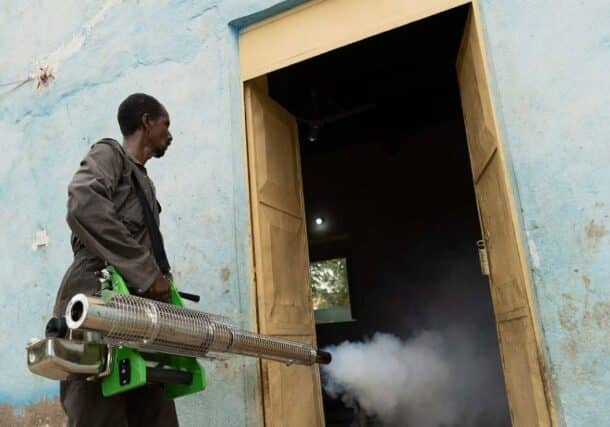 A sanitation worker sprays disinfectant to combat the spread of disease, in Kassala state in eastern Sudan on August 20, 2024. (AFP photo)