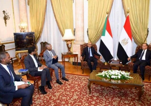 Egypt's Foreign Minister Badr Abdel-Aty (L) received his Sudanese counterpart Hussein Awad ahead of the Arab League meeting on Tuesday