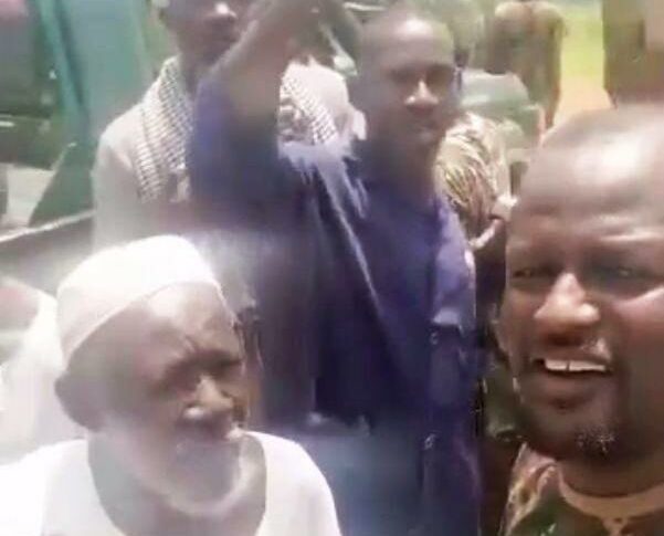 Sudanese soldiers stand with Al-Shayqab villagers about 12 km west of Wad Madani, on September 19, 2024