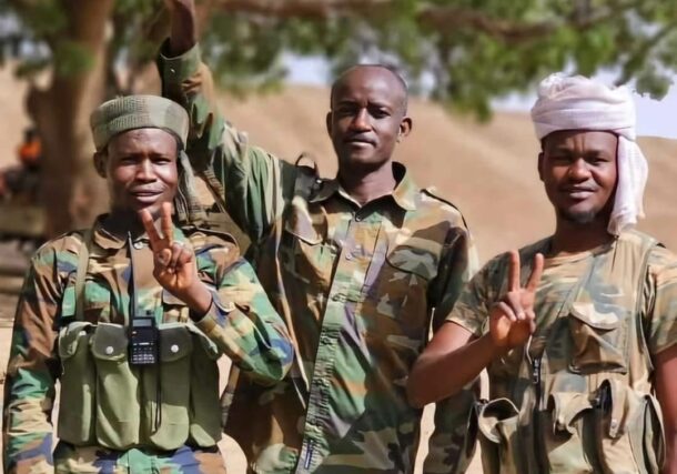 Sudanese troops flash victory signs after successfully repelling an RSF attack on Thursday, September 19th, 2024.