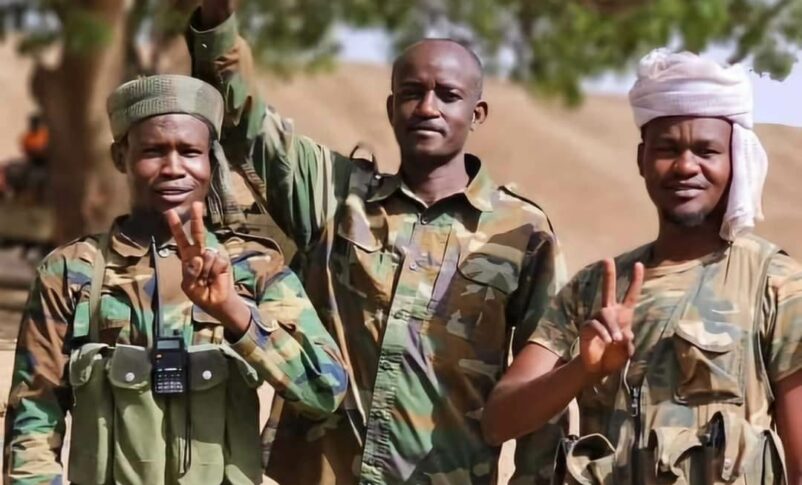 Sudanese troops flash victory signs after successfully repelling an RSF attack on Thursday, September 19th, 2024.
