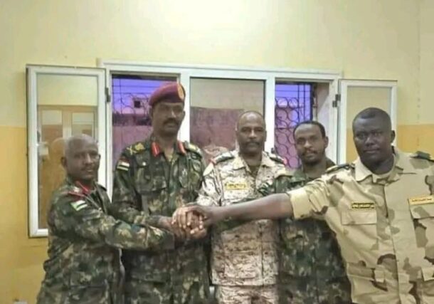 Abu Aqla Kikl (2nd from left) in Sudanese army uniform after his defection from the RSF.