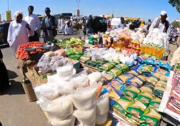 Food and vegetables vendor in Port Sudan market.