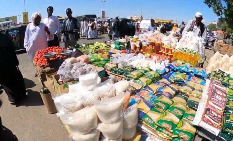 Food and vegetables vendor in Port Sudan market.