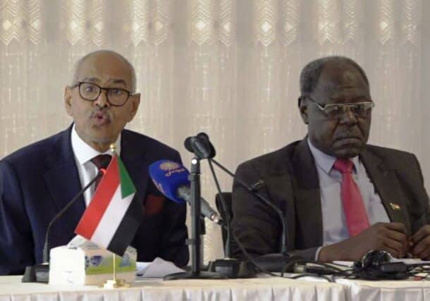 Sudan FM Hussein Awad (L) and Information Minister Graham Abdel Qadir speak to the media in Port Sudan on October 14, 2024