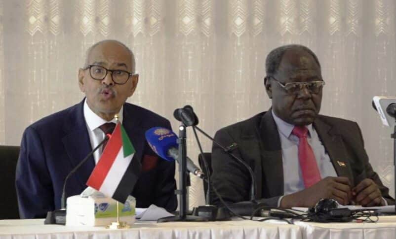 Sudan FM Hussein Awad (L) and Information Minister Graham Abdel Qadir speak to the media in Port Sudan on October 14, 2024