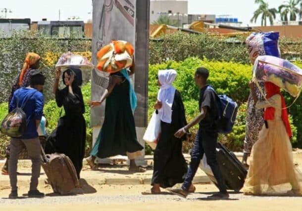 Civilian flee from southern Khartoum as fighting between the army and paramilitary forces led by rival generals rages on. (AFP-Getty Images)-