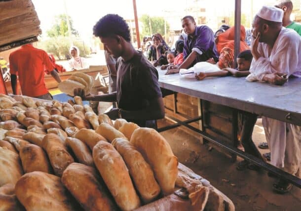 People gather to get bread while clashes rage between the Sudanese army and the paramilitary RSF in Khartoum North, on April 24, 2023. Reuters photo