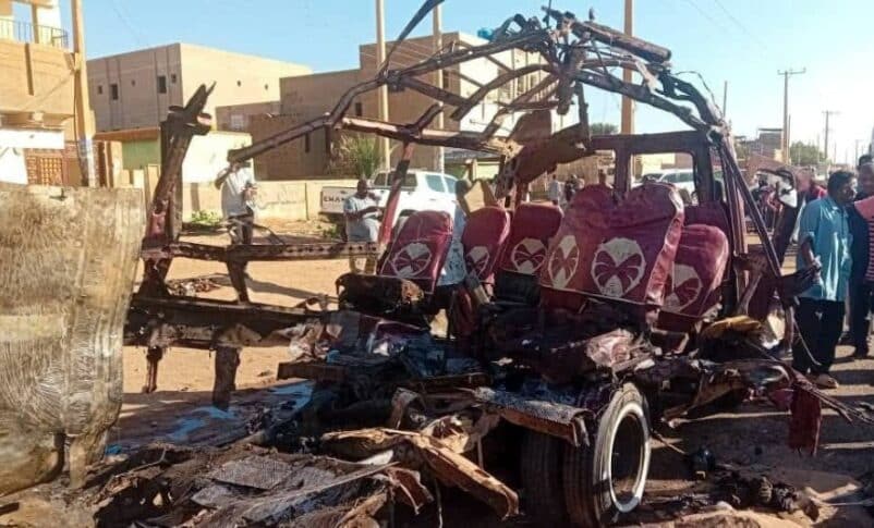 A minibus lies in ruins in Karari after being struck by a RSF shell, resulting in the tragic deaths of 22 passengers on Dec 10, 2024