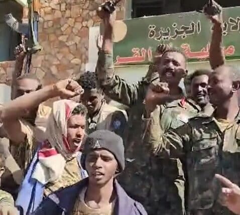 Abu Aqla Kikl with troops outside the Umm Al-Qura municipality, Al Jazirah state, Dec. 2, 2024.