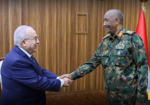 Al-Burhan shakes hands with Lamamra on December 23, 2024