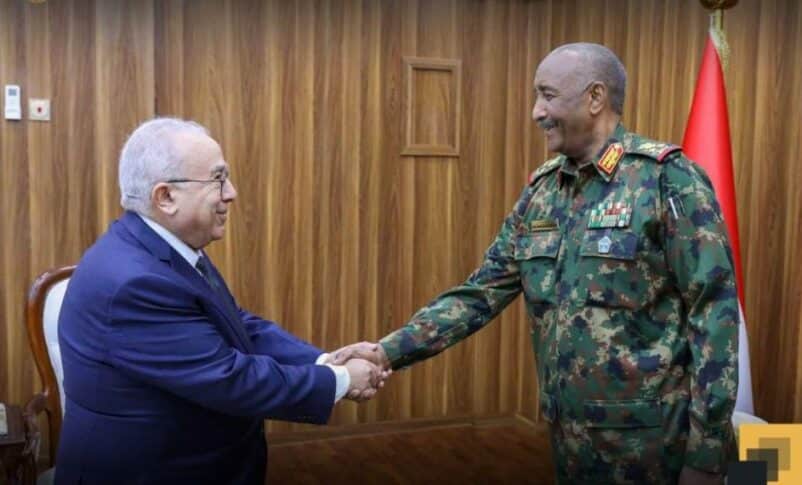 Al-Burhan shakes hands with Lamamra on December 23, 2024