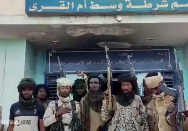 RSF fighters pose outside poliice station in Um Al Qura on December 7, 2024