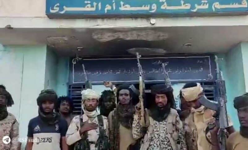 RSF fighters pose outside poliice station in Um Al Qura on December 7, 2024