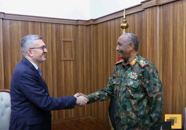 Lt Gen Abdel Fattah al-Burhan sshakes hands wit Turkish deputy FM Burhanettin Duran on Dec 4,2025