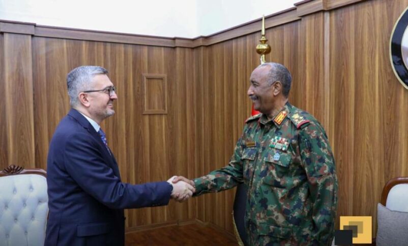 Lt Gen Abdel Fattah al-Burhan sshakes hands wit Turkish deputy FM Burhanettin Duran on Dec 4,2025