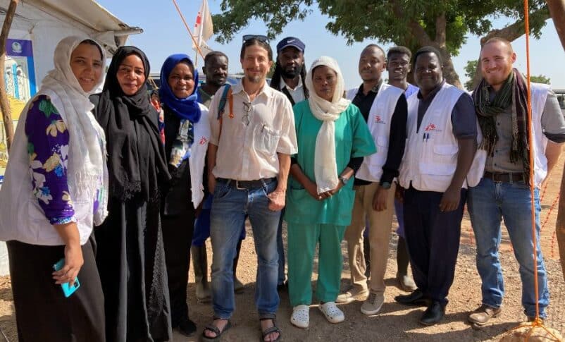 MSF head Stephen Cornish poses with the Sudanese medical workers at at Um Rakuba camp in Gederaf on December 30, 2024