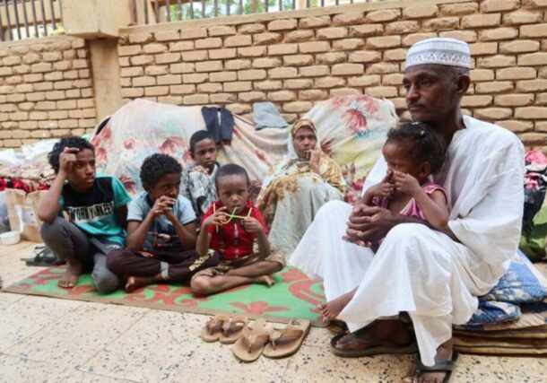 Mohamed Awad and his family rest after leaving Tuti Island, which is controlled by RSF, in Omdurman, Sudan, Nov 10, 2024. Reuters