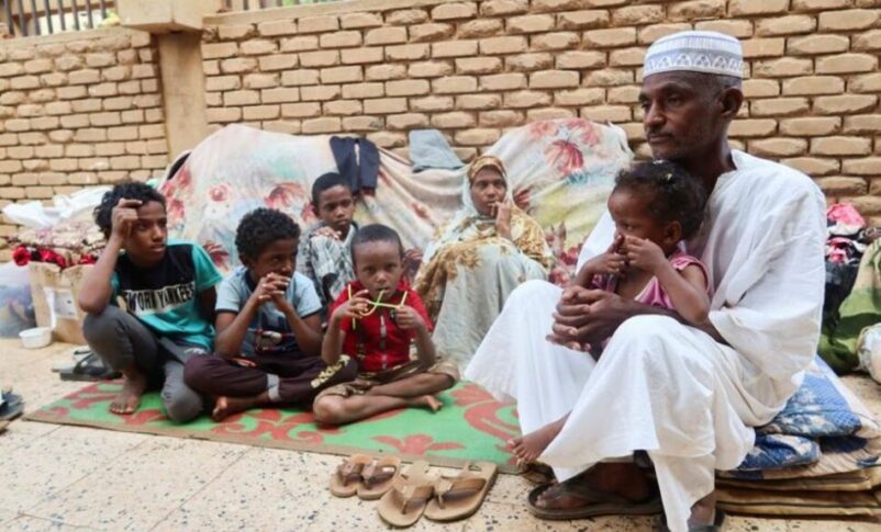 Mohamed Awad and his family rest after leaving Tuti Island, which is controlled by RSF, in Omdurman, Sudan, Nov 10, 2024. Reuters